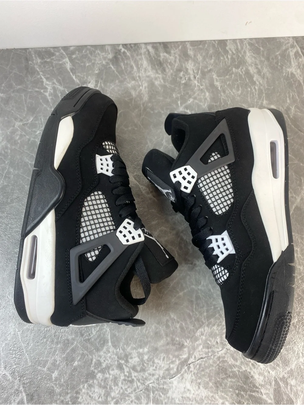 Jordan Black and White Low-Top Retro Sneakers